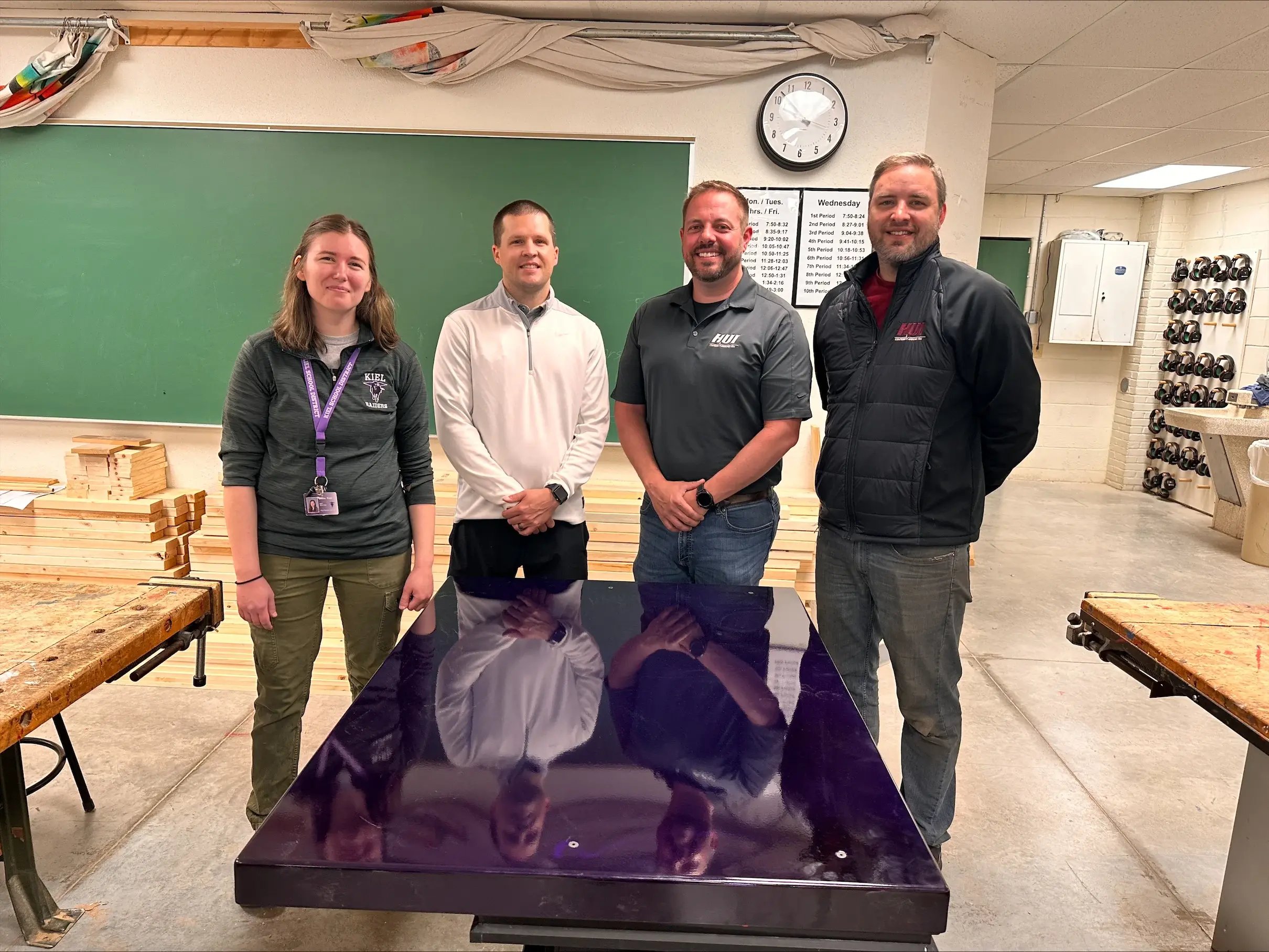 hydraulic-shop-table-with-hui-manufacturing-employee-and-kiel-middle-school-employees